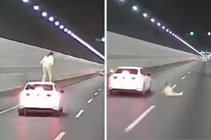 女子爬到車頂　行駛途中突然跳下